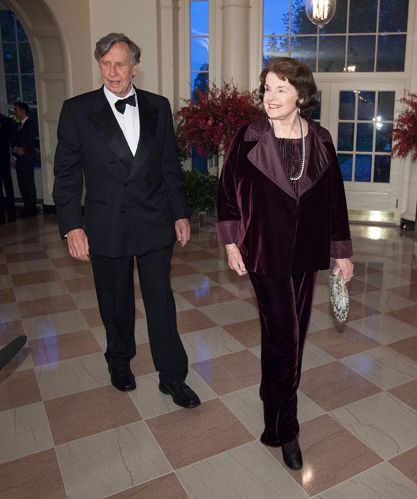 Dianne Feinstein, U.S. Senator and Richard Blum arrive at the State Dinner for Chinese leader Xi Jinping and Madame Peng Liyuan at the White House for an official state visit in Washington on Sept. 25, 2015. (Photo by Chris Kleponis-Pool/Getty Images)