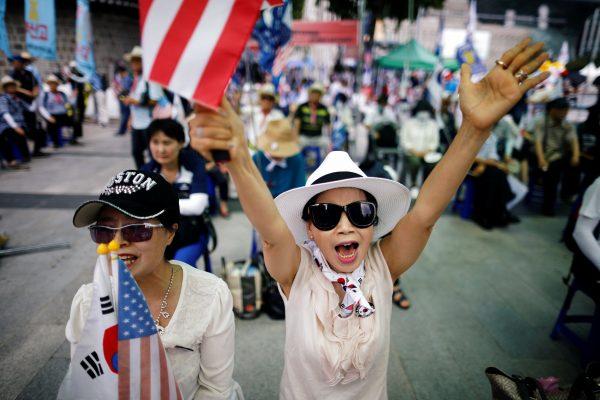 Members of a conservative civic group attend an anti-North Korea and pro-U.S. protest in Seoul, South Korea, Aug. 4, 2018. (Reuters/Kim Hong-Ji)