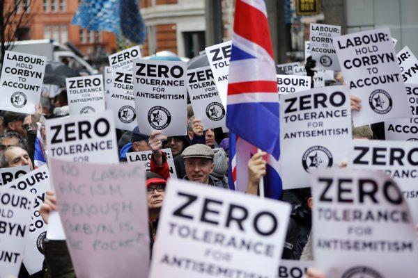 People gather for a demonstration outside the head office of the British opposition Labour Party in central London on April 8, 2018. (Tolga Akmen/AFP/Getty Images)