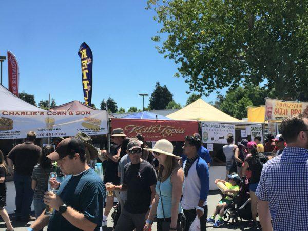 People at the Fremont Festival of Arts with food stalls in the background on August 5, 2018 (EETSF).