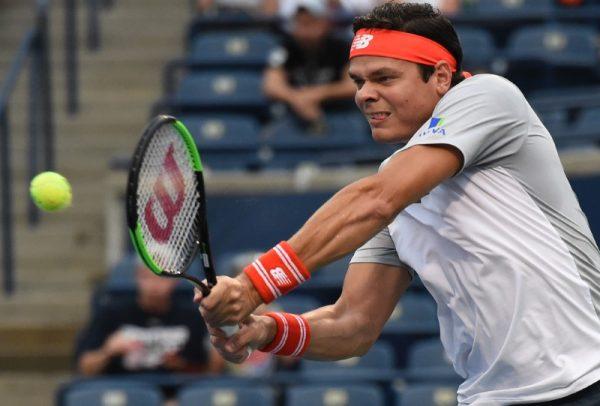 Aug 6, 2018; Toronto, Ontario, Canada; Milos Raonic of Canada plays a shot against David Goffin of Belgium in the Rogers Cup tennis tournament at Aviva Centre. (Dan Hamilton—USA TODAY Sports)