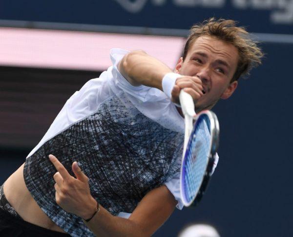 Aug 6, 2018; Toronto, Ontario, Canada; Daniil Medvedev of Russia hits a shot against Jack Sock of the USA (not shown) in the Rogers Cup tennis tournament. (Dan Hamilton—USA TODAY Sports)