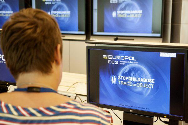 A Europol police agent looks at a new website, which shows everyday objects found in the background of child sex abuse images, in the hope that it will lead police around the world to victims and help arrest perpetrators. (Jan Hennop/AFP/Getty Images)
