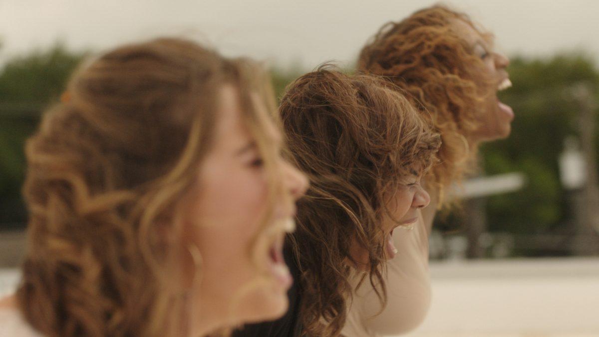 (L–R) Maci (Haley Lu Richardson), Lisa (Regina Hall), and Danyelle (Shayna McHayle) engaging in some rooftop primal-scream therapy in “Support the Girls.” (Magnolia Pictures)