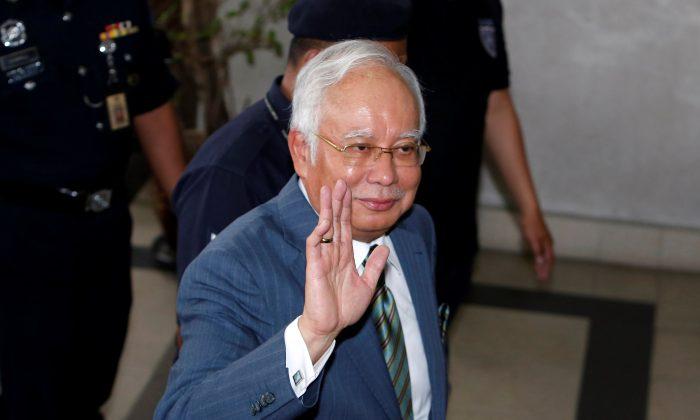 Former Malaysian Prime Minister Leads Party to Landslide Victory in State Elections