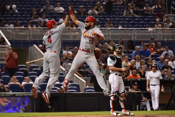 Aug 7, 2018; Miami; St. Louis Cardinals first baseman Matt Carpenter celebrates with catcher Yadier Molina after hitting a solo home run in the eighth inning against the Miami Marlins. (Jasen Vinlove-USA TODAY Sports)