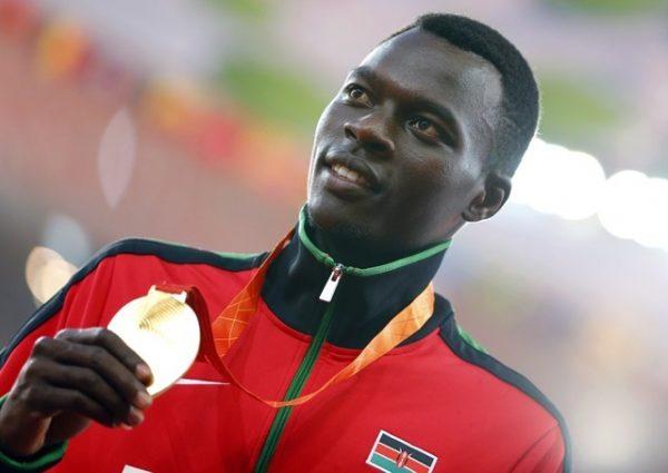 Nicholas Bett of Kenya presents his gold medal on the podium after the men's 400 meters hurdles event during the 15th IAAF World Championships at the National Stadium in Beijing, China, Aug. 26, 2015. (Reuters/Damir Sagolj)