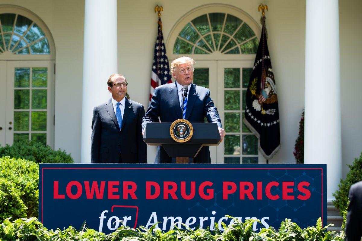 President Donald Trump (R) and Secretary of Health and Human Services Alex Azar give remarks on lowering drug prices in the Rose Garden of the White House on May 11, 2018. (Samira Bouaou/The Epoch Times)