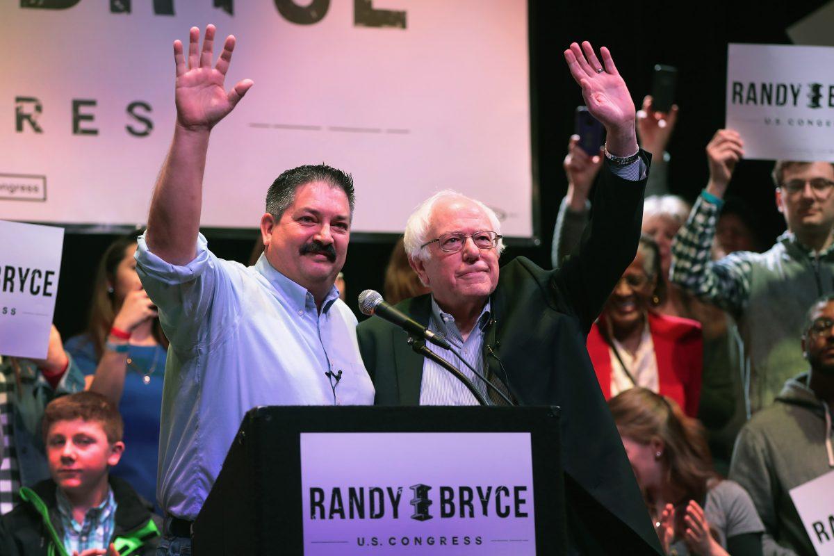 Socialist Sen. Bernie Sanders (I-Vt.) (right) campaigns with congressional candidate Randy Bryce at a rally on Feb. 24, 2018 in Racine, Wisconsin. Bryce takes left-wing positions and is referred to by Wisconsin Republicans as a socialist. (Scott Olson/Getty Images)