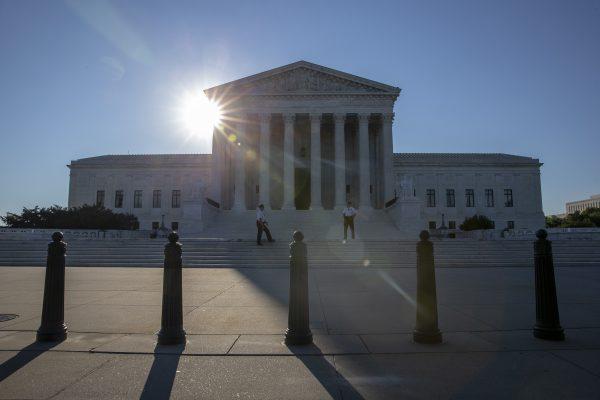The sun rises over the United States Supreme Court in Washington on the morning of July 10, 2018. (Photo by Alex Edelman/Getty Images)