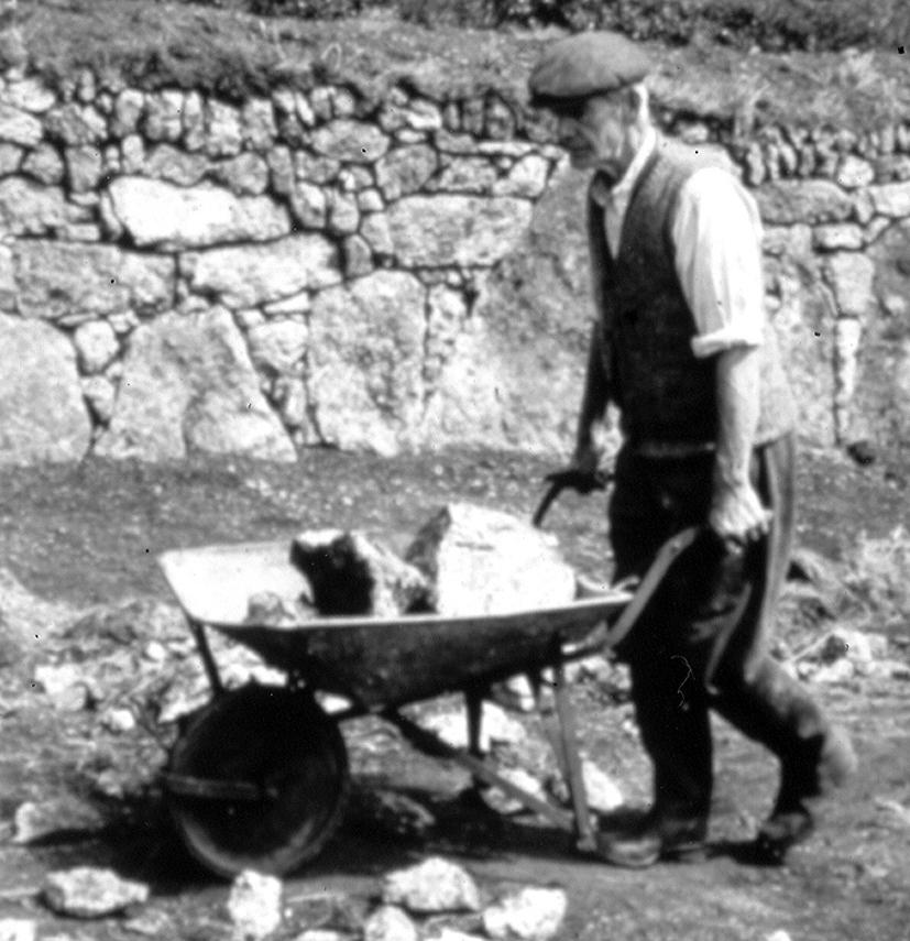 <span style="color: #000000">Billy Rawlings with a wheelbarrow of rocks. (The Minack Theatre)</span>