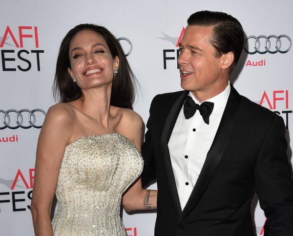 Angelina Jolie Pitt and Brad Pitt arrive for the opening night gala premiere of 'By the Sea' during AFI FEST 2015 in Hollywood, California on Nov. 5, 2015. (MARK RALSTON/AFP/Getty Images)