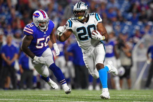 Aug. 9, 2018; Orchard Park, N.Y.; Carolina Panthers running back C.J. Anderson runs with the ball in front of Buffalo Bills linebacker Ramon Humber during the third quarter. (Rich Barnes—USA TODAY Sports)