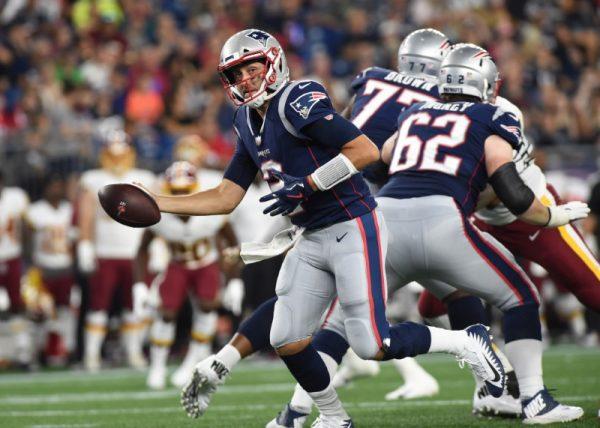 Aug. 9, 2018; Foxborough, Mass.; New England Patriots quarterback Brian Hoyer fakes a handoff during the first half against the Washington Redskins. (Bob DeChiara—USA TODAY Sports)