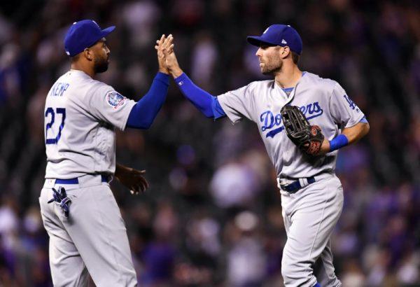Aug. 9, 2018; Denver, Colo.; Los Angeles Dodgers left fielder Matt Kemp and center fielder Chris Taylor celebrate the win over the Colorado Rockies. (Ron Chenoy—USA TODAY Sports)