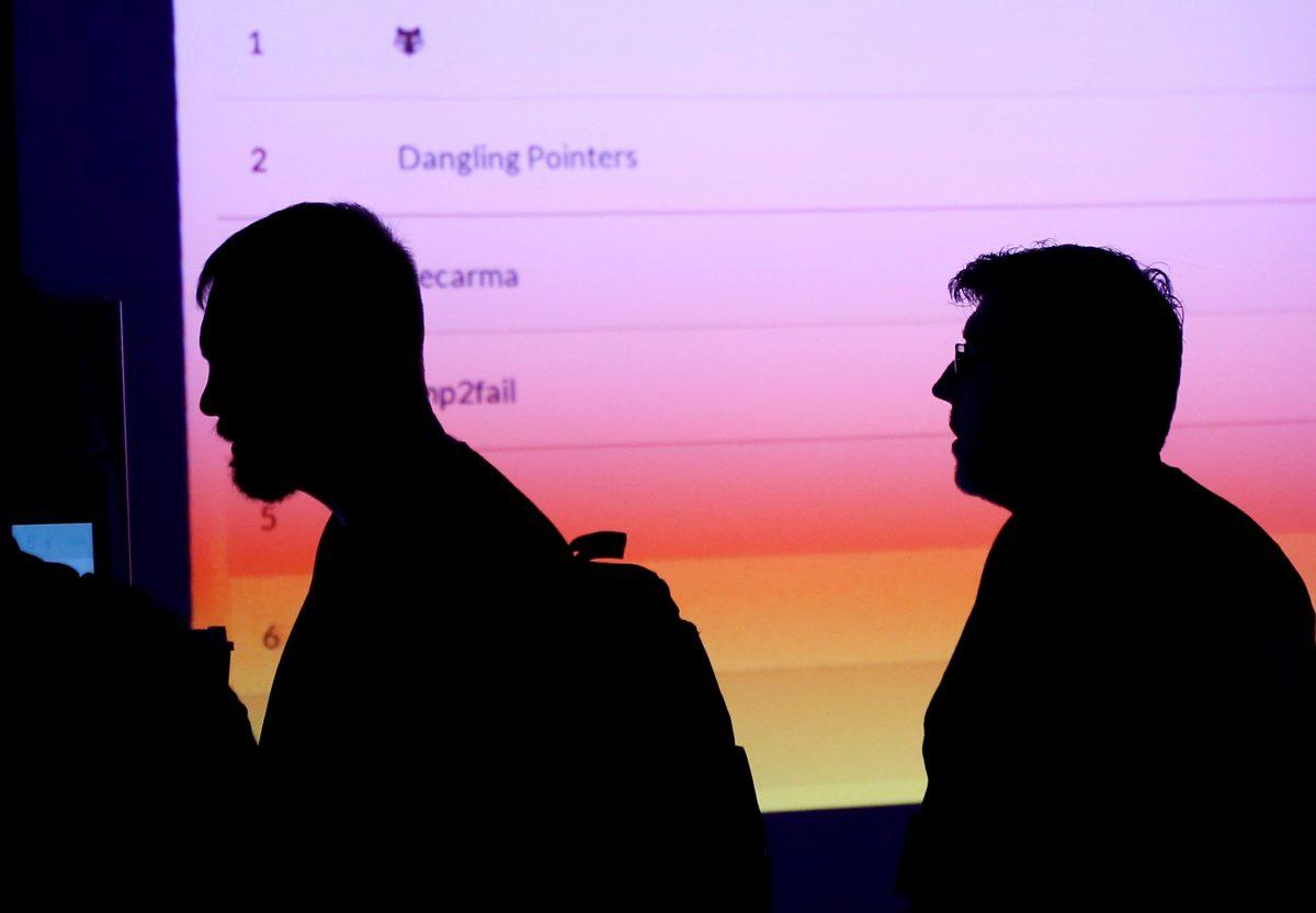 Participants are silhouetted as they pass through the IoT (internet of things) Village during the Def Con hacker convention in Las Vegas, on July 29, 2017. (Steve Marcus/Reuters/File Photo)