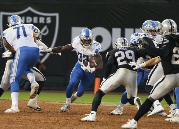 Detroit Lions running back Kerryon Johnson carries the ball against the Oakland Raiders during the first quarter. (Kelley L Cox—USA TODAY Sports)