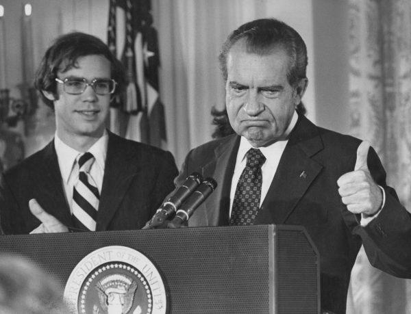 Former President Richard Nixon (1913-1994) gives the thumbs up as he addresses the White House staff upon his resignation as 37th President of the United States, Washington, Aug. 9, 1974. His son-in-law, David Eisenhower, is with him on the left. (Keystone/Hulton Archive/Getty Images)