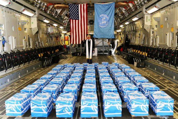 U.S. Army Col. Sam Lee, command chaplain for the United Nations, performs a blessing on 55 boxes of remains thought to be of U.S. soldiers killed in the 1950-53 Korean War and returned by North Korea to the United States at the Osan Air Base in South Korea on July 27, 2018. (U.S. Army Sgt. Quince Lanford/via Reuters)