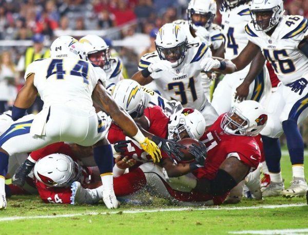 Arizona Cardinals running back Chase Edmonds dives as he crosses the goal line to score a touchdown against the Los Angeles Chargers. (Mark J. Rebilas/USA Today Sports)