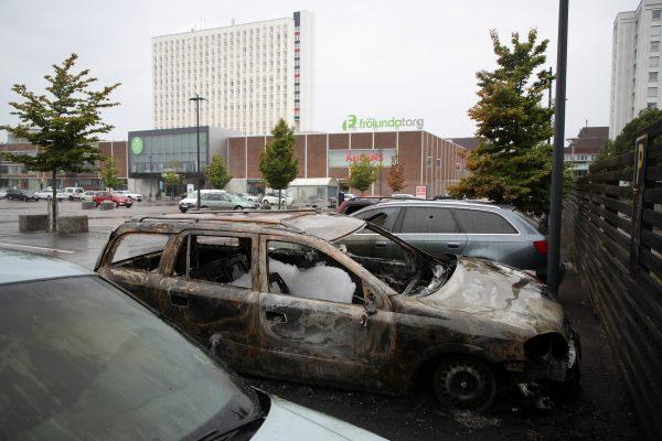 Burned cars in Frolunda Square in Gothenburg, Sweden on Aug. 14, 2018. (Adam Ihse/TT News Agency/via Reuters)