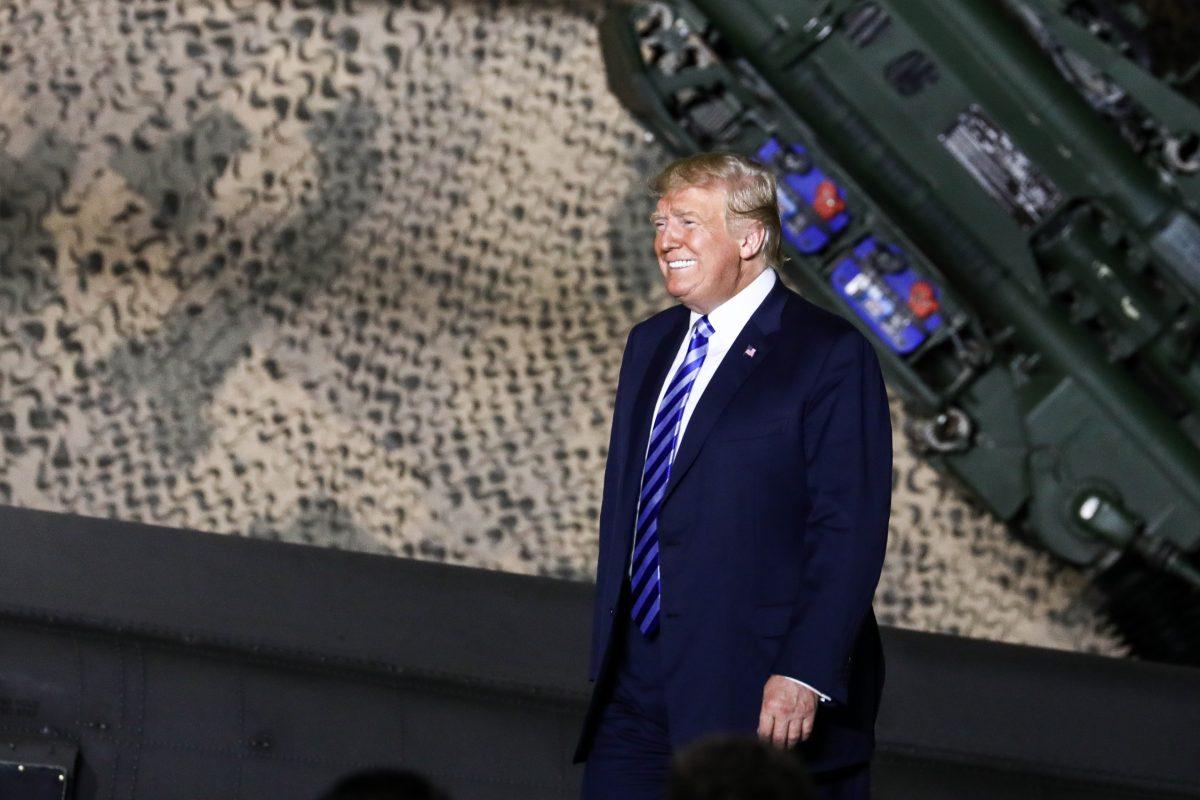 President Donald Trump arrives to speak at Wheeler-Sack Army Airfield before signing the 2019 National Defense Authorization Act, at Fort Drum, N.Y., on Aug. 13, 2018. (Charlotte Cuthbertson/The Epoch Times)