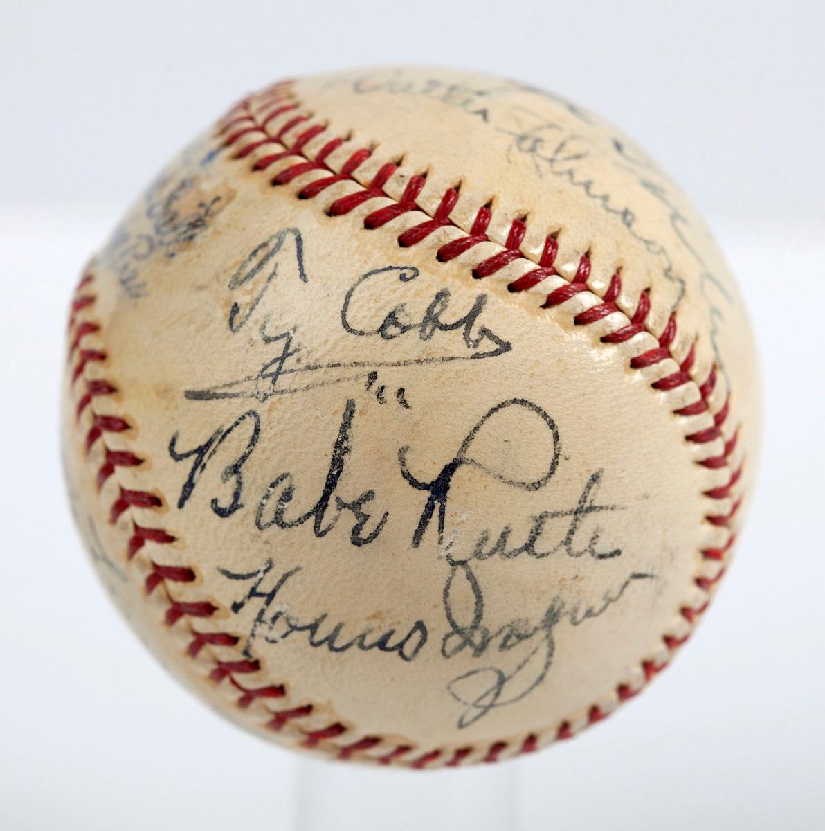 A baseball with the signatures of Babe Ruth, Ty Cobb, Honus Wagner and eight other legends of the game that has sold for more than $600,000 SCP Auctions said on Aug. 13, 2018. (SCP Auctions/AP)