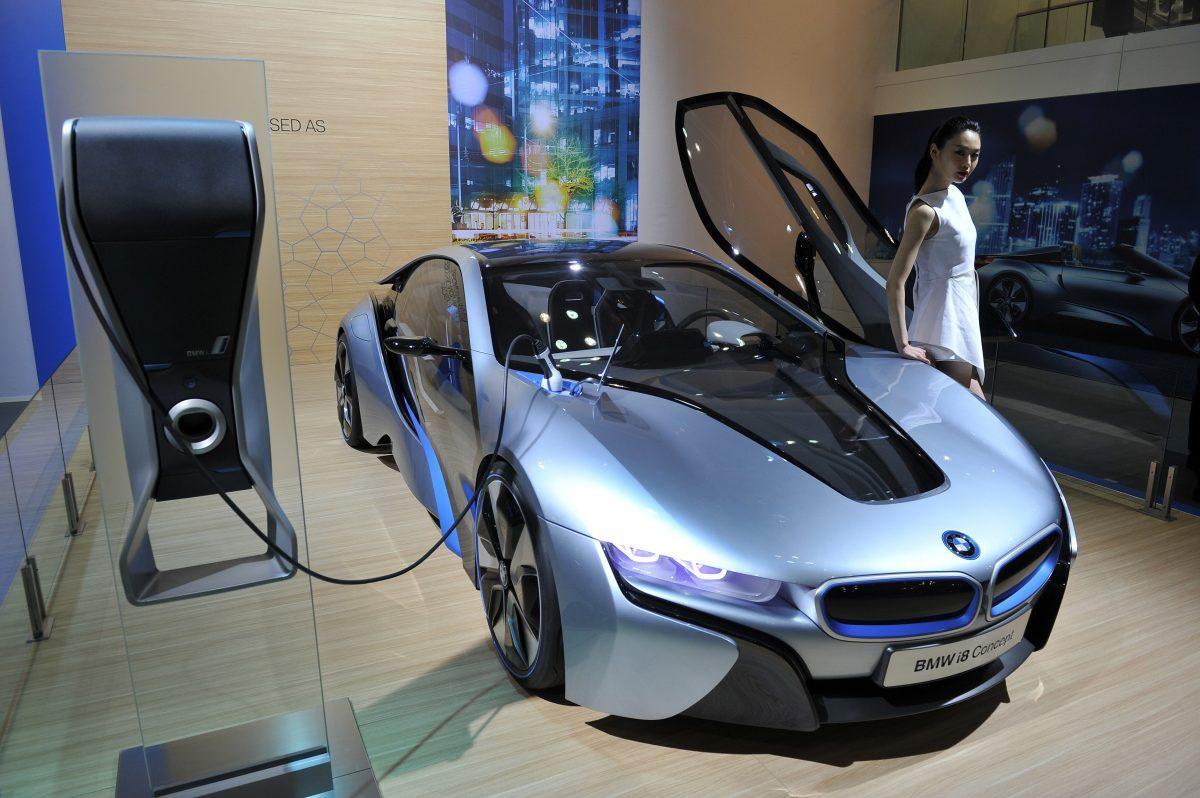 A South Korean model posing with BMW i8 Concept during a press preview of the Seoul Motor Show in Goyang, north of Seoul on March 28, 2013. (Jung Yeon-je/AFP/Getty Images)