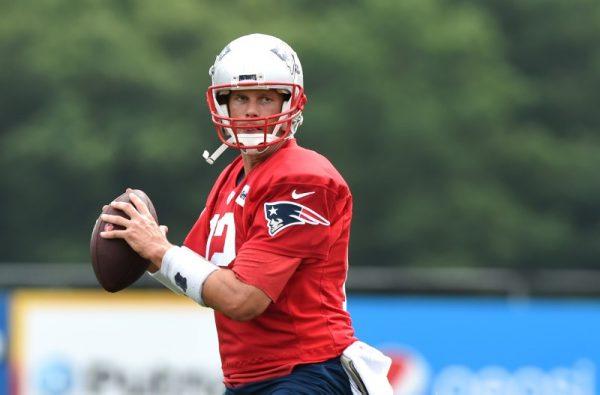 New England Patriots quarterback Tom Brady gets set to throw a pass during training camp at Gillette Stadium on Jul. 26, 2018. (Bob DeChiara/USA Today Sports)
