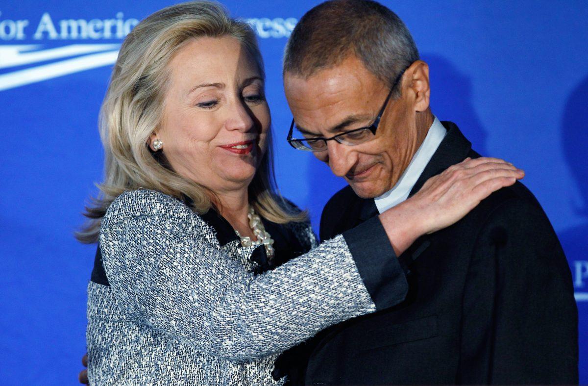 Then Secretary of State Hillary Clinton and John Podesta, who would become her campaign chairman during the 2016 elections, in Washington, on Oct. 12, 2011. (Chip Somodevilla/Getty Images)