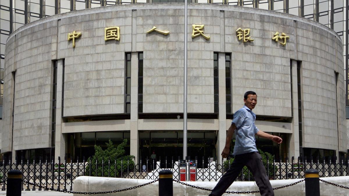 A pedestrian walks past the People's Bank of China, also known as China's Central Bank, in Beijing on Aug. 22, 2007. (Teh Eng Koon/AFP/Getty Images)