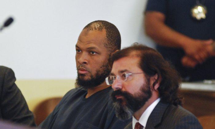 Siraj Ibn Wahhaj (L), sits next to public defense attorney Aleks Kostich at his first appearance in New Mexico state district court in Taos, N.M., Wednesday, Aug. 8, 2018. (Morgan Lee/AP)