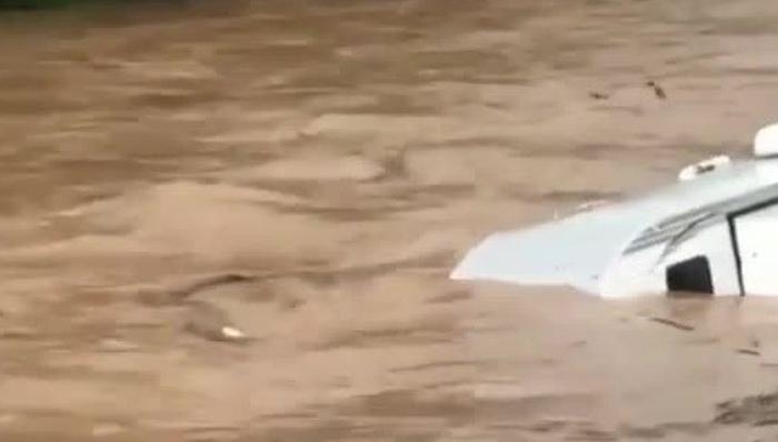 Watch: Camper Floats Down Flooded Pennsylvania Creek