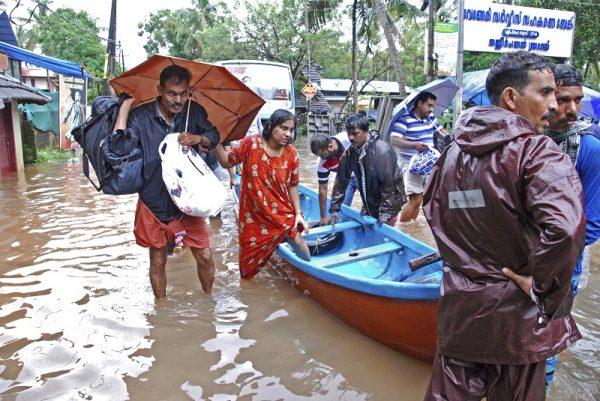 Torrential monsoon rains have disrupted air and train services in the southern Indian state of Kerala. (AP Photo/K. Shijith)