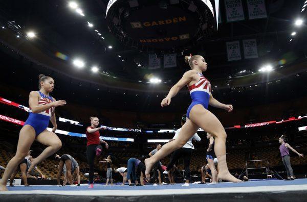Ragan Smith warms up with other athletes during a training session at the U.S. Gymnastics Championships in Boston. (AP/Elise Amendola)
