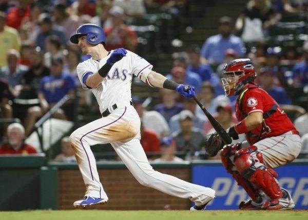 Texas Rangers center fielder Carlos Tocci singles in the seventh inning against the Los Angeles Angels. (Ray Carlin/USA Today Sports)