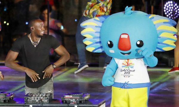 Usain Bolt, retired Jamaican world record sprinter, performs as a DJ at Carrara Stadium during the closing ceremony of the 2018 Commonwealth Games on the Gold Coast, Australia. (AP/Mark Schiefelbein)