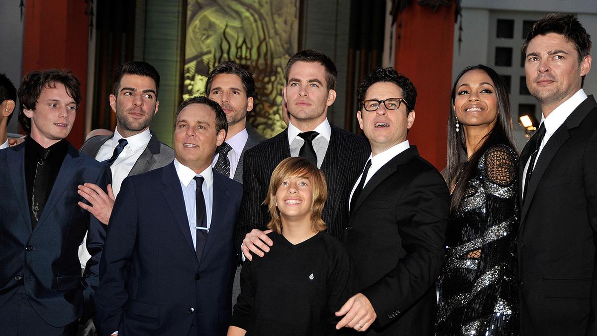 (L-R) Actors Anton Yelchin, Zachary Quinto, executive/producer Bryan Burk, Eric Bana, Chris Pine, Jimmy Bennett, director/producer J.J. Abrams, actors Zoe Saldana and Karl Urban arrive at the Los Angeles premiere of 'Star Trek' in Hollywood on April 30, 2009. (Kevin Winter/Getty Images)