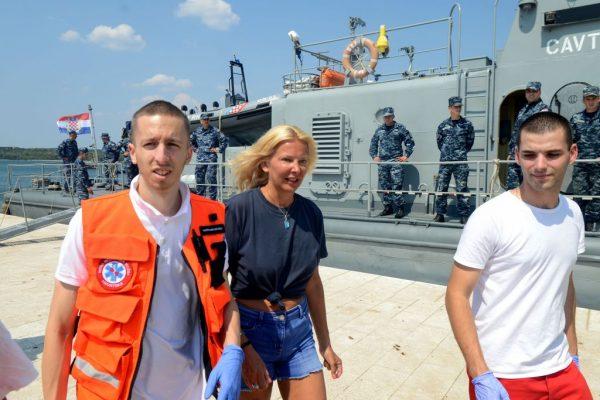 British tourist Kay Longstaff (C) exits a Croatian coast guard ship in Pula, on Aug. 19, 2018. She was rescued after falling off a cruise ship near the Croatian coast. (STR/AFP/Getty Images)