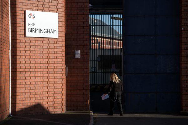 A member of the prison staff arrives at HMP Birmingham, central England on Dec. 17, 2016. Staff members were found asleep and locking themselves away from prisoners during an inspection in August 2018 that resulted in the operation of the G4S facility being taken over by the government.<br/>(Oli Scarff/AFP/Getty Images)