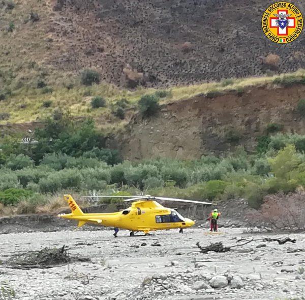 A rescue helicopter is seen after several people were killed in a mountain gorge flooding, in the municipality of Civita, Calabria, Italy, on Aug. 20, 2018, in this image obtained from social media. (Corpo Nazionale Soccorso Alpino e Speleologico/Reuters)