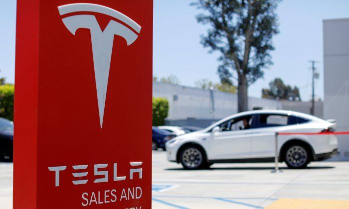 Deal-Hungry Investment Bankers Walk Tesla Tightrope