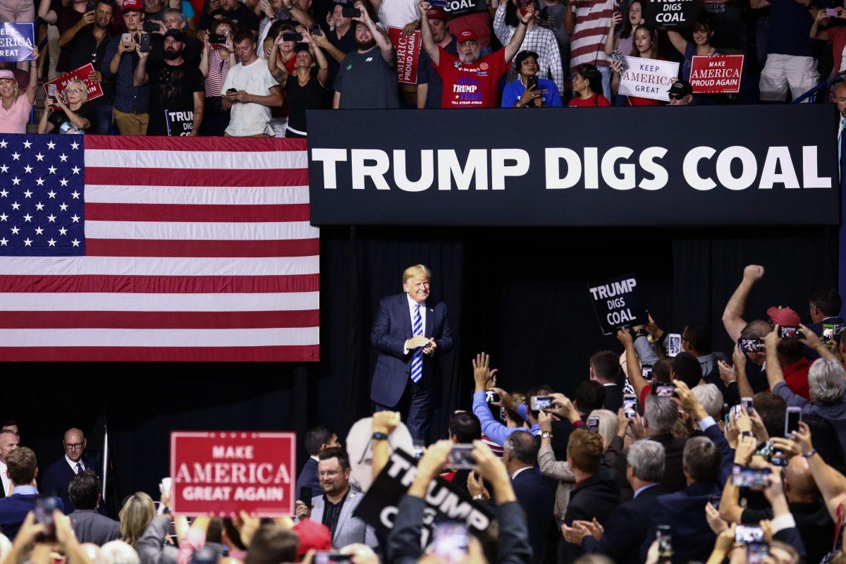 President Donald Trump comes onstage at a Make America Great Again rally in Charleston, W. Va., on Aug. 21, 2018. (Charlotte Cuthbertson/The Epoch Times)
