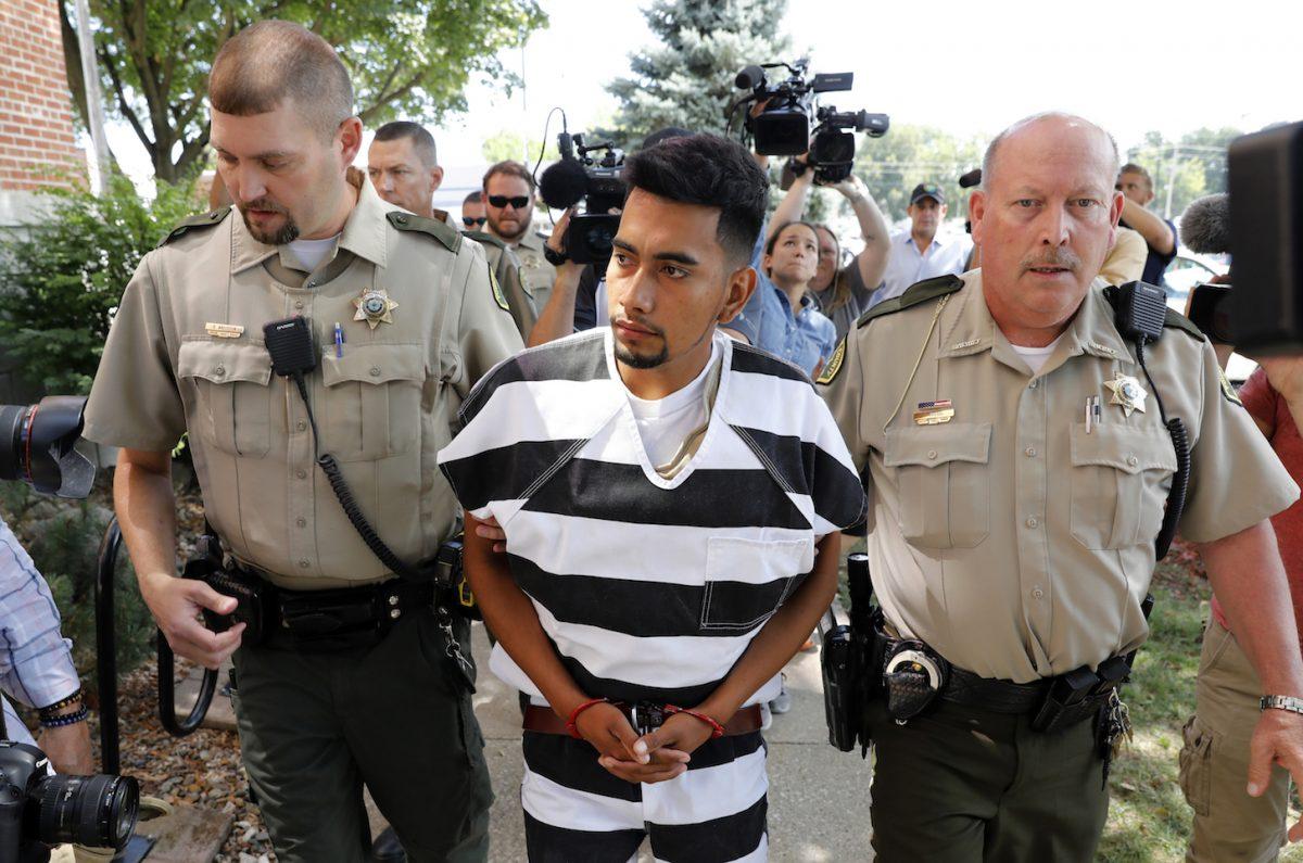 Cristhian Bahena Rivera is escorted into the Poweshiek County Courthouse for his initial court appearance in Montezuma, Iowa, on Aug. 22, 2018. Rivera is charged with first-degree murder in the death of Mollie Tibbetts, who disappeared from Brooklyn, Iowa, on July 18. (AP Photo/Charlie Neibergall)