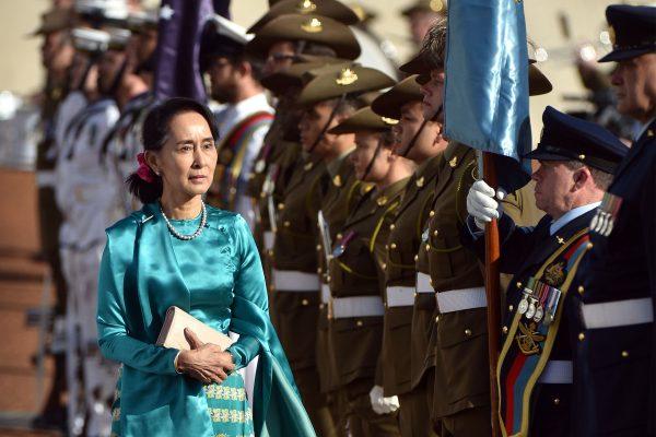 Aung San Suu Kyi (L) receives an official welcome on the forecourt during her visit to Parliament House in Canberra, Australia, on March 19, 2018. (Mark Graham/AFP/Getty Images)