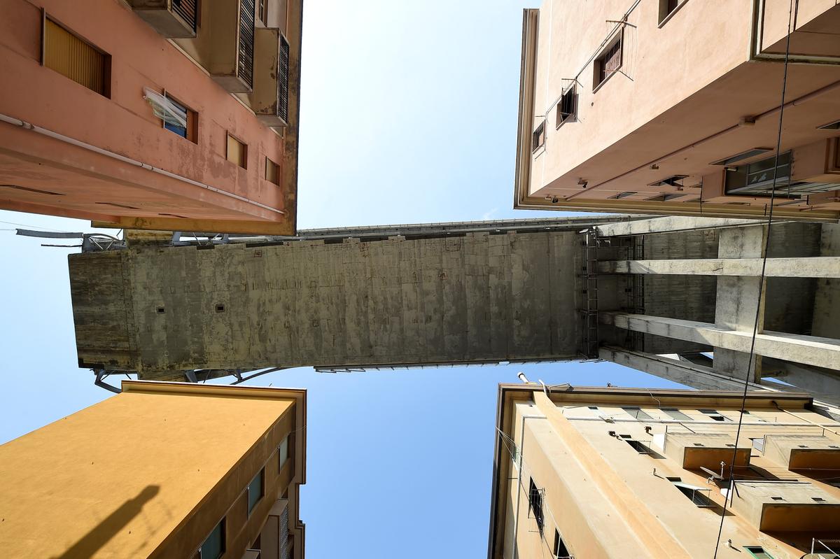 A section of the collapsed Morandi Bridge is seen above, from the "red zone" restricted area in Genoa, Italy on Aug. 17, 2018. (Reuters/Massimo Pinca)