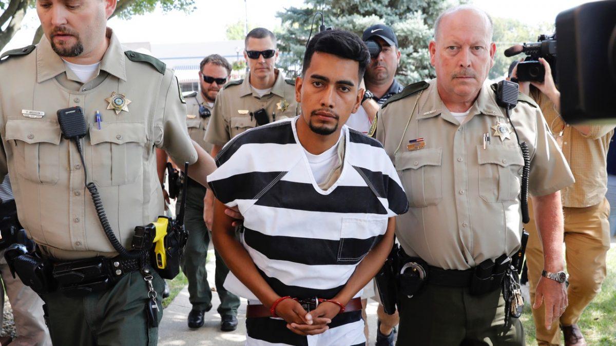 Cristhian Bahena Rivera is escorted into the Poweshiek County Courthouse for his initial court appearance in Montezuma, Iowa on Aug. 22, 2018. (AP Photo/Charlie Neibergall)