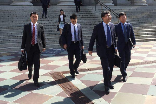 Members of a Chinese trade delegation leave the building of the U.S. Treasury after two days of talks with U.S. representatives in Washington DC on August 23, 2018. (Virgine Montet/AFP/Getty Images)