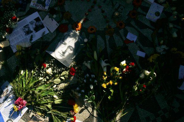 A picture of slain rock star John Lennon lies among flowers and memorabilia in Strawberry Fields, a memorial area to him in Central Park December 8, 2005, in New York City. (Chris Hondros/Getty Images)