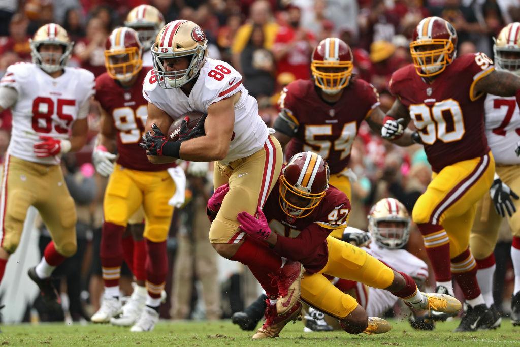 Tight end Garrett Celek #88 of the San Francisco 49ers is tackled by cornerback Quinton Dunbar #47 of the Washington Redskins during the first half at FedExField on Oct. 15, 2017 in Landover, Md. (Patrick Smith/Getty Images)